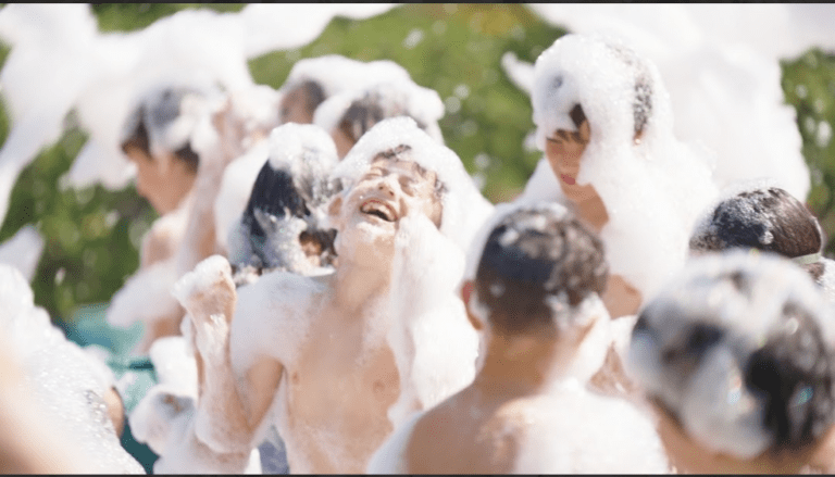 Kids having fun in foam at a birthday party with Rolling Video Games