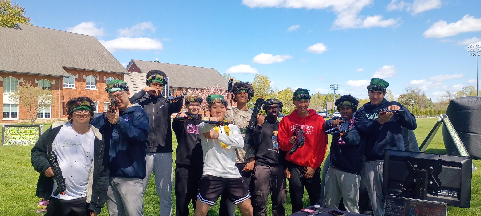 Group of kids posing together after laser tag birthday party with big smiles