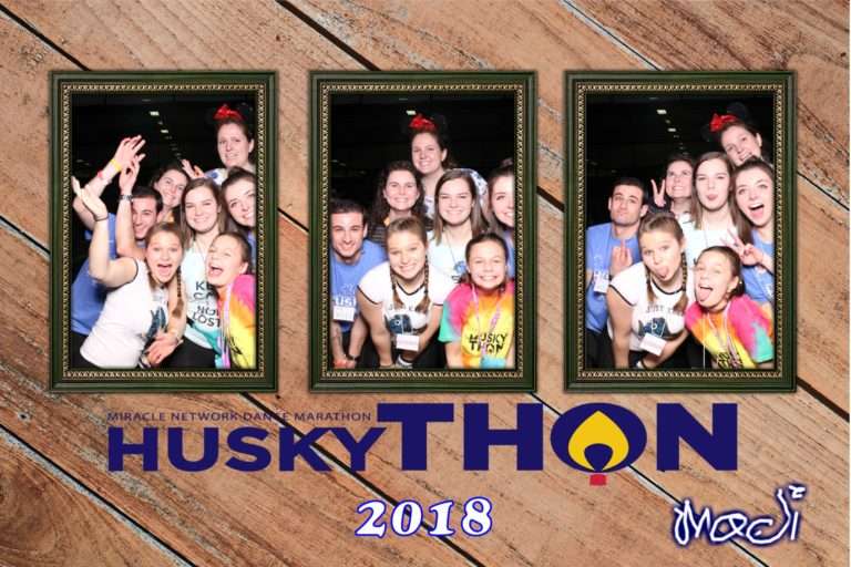 Students at UConn HuskyThon 2018 fundraiser enjoying Rolling Video Games photo booth entertainment