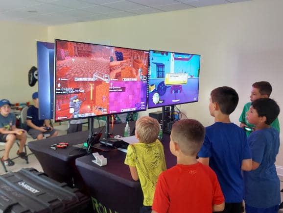 Game hub set up inside a garage hosted by Rolling Video Games for a birthday party