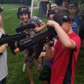 Kids checking out laser guns