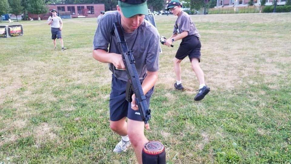 adult playing laser tag