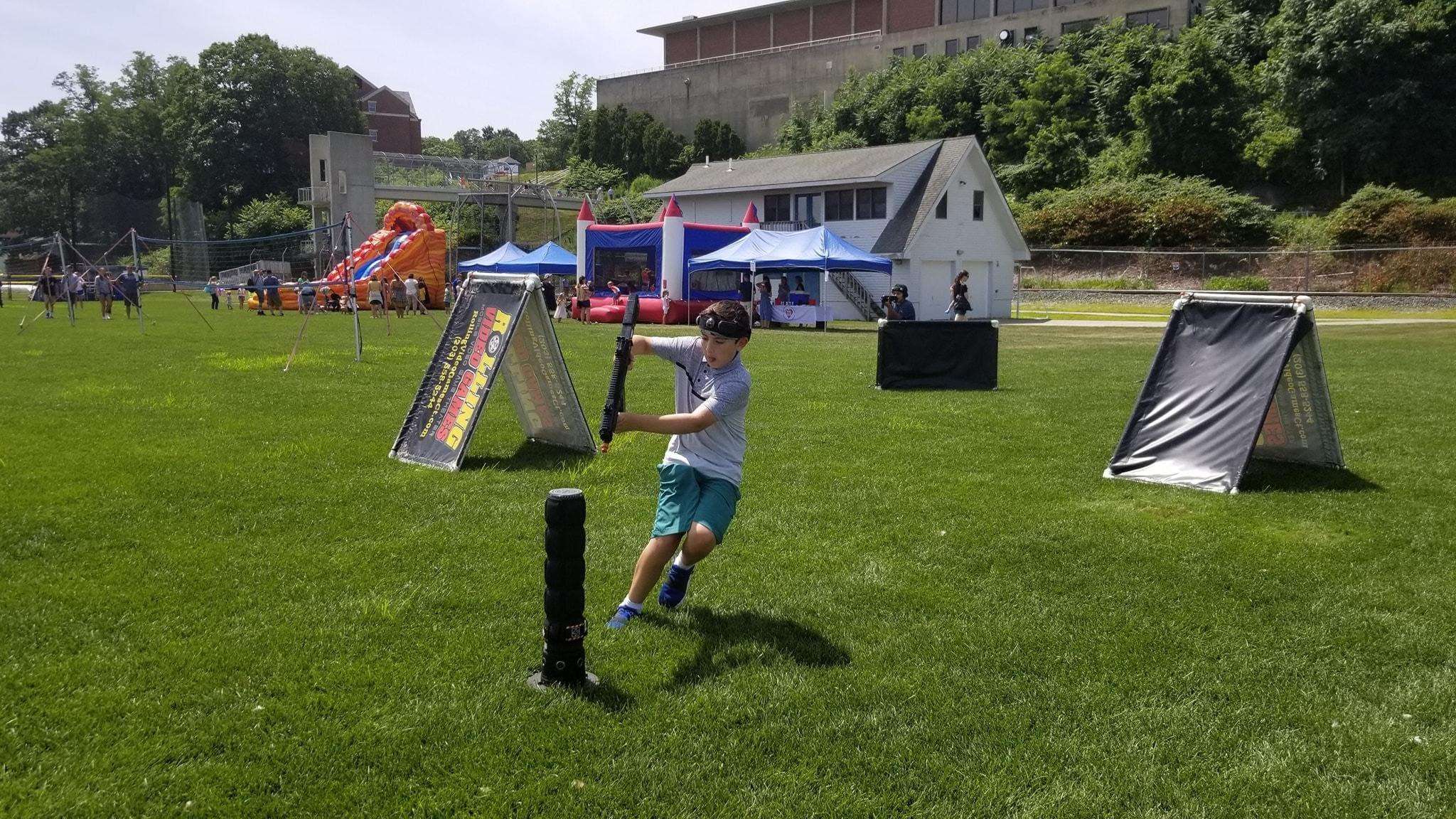 Child playing laser tag 