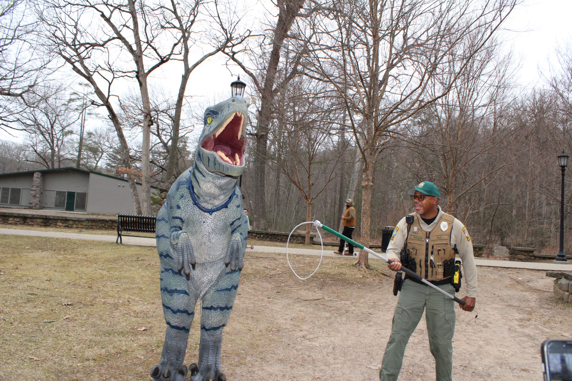  primal the raptor dinosaur character playfully caught by animal control rolling video games connecticut dinosaur party entertainment