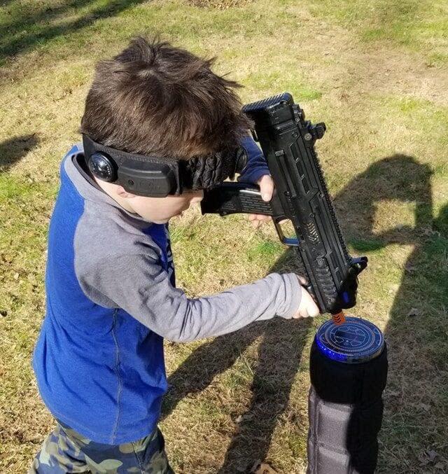 child playing laser tag