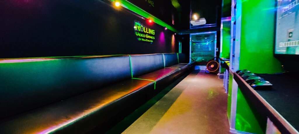 Rolling Video Games game trailer interior with stadium seating and multiple HD gaming screens in Connecticut