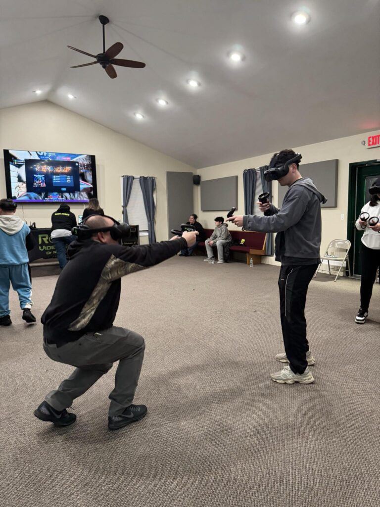 Guests playing free roam virtual reality at a Rolling Video Games party